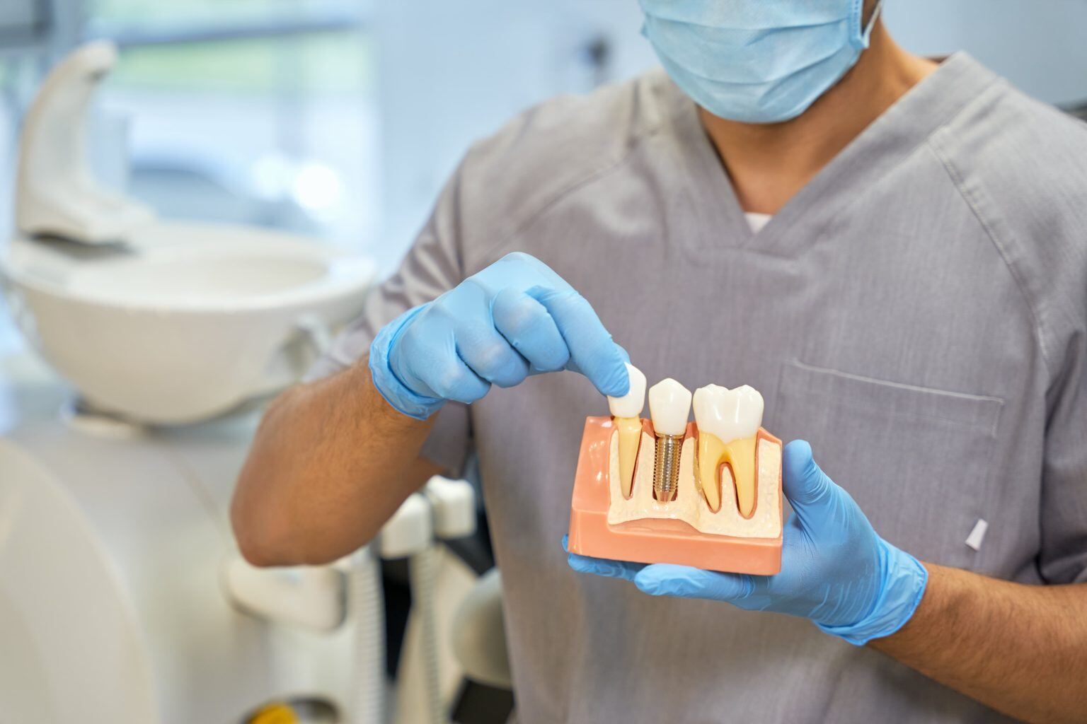 skillful-dental-technician-showing-anatomy-of-dent-2022-09-29-20-15-49-utc-min-1536x1024